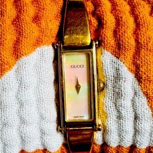 Gucci 1500L Vintage 1990’s Gold bangle with mother of pearl face.